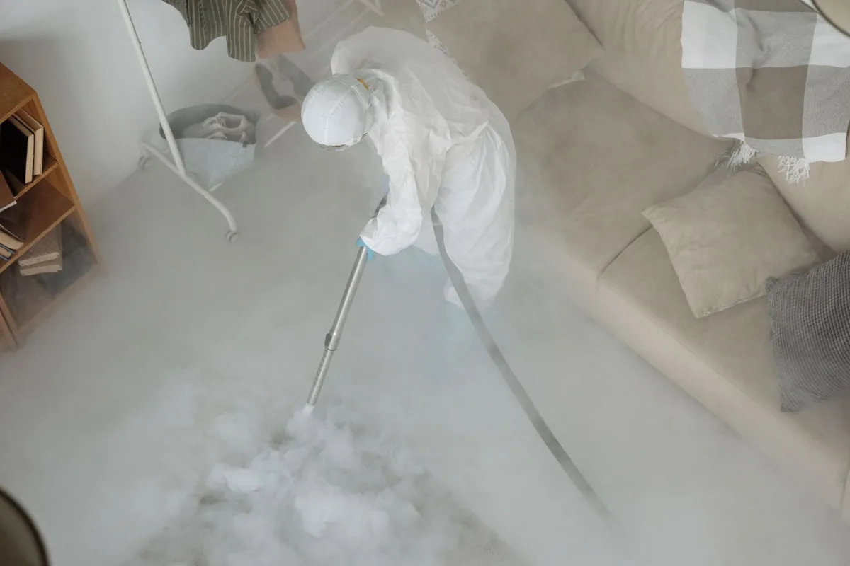 Biohazard cleanup technician in protective equipment, Windom, MN